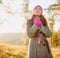 Young woman walking in the fall season. Autumn outdoor portrait