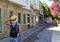 Young woman walking in narrow street in Alacati, Cesme