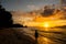 Young woman walking and relaxing in a tropical beach on the suns