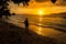 Young woman walking and relaxing in a tropical beach on the suns