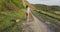 Young woman walking with Scottish cat in outdoor