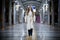 Young woman walking in the subway waiting for the train.