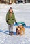 Young woman walking with two American Pit Bull Terrier winter