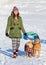 Young woman walking with two American Pit Bull Terrier winter