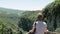 Young woman walks on observation deck. Okatse Canyon, near Kutaisi, Georgia