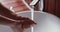 Young woman washing hands with liquid soap sanitizer gel, closeup