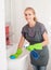 Young woman washing sink