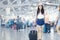 Young woman watching plane before departure