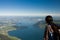 Young woman watching to the Zugersee from the top of the Rigi