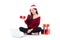 Young woman wear santa hat and gift box sitting labtop