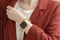 Young woman wear trendy jacket and smartwatch. Wearable gadget concept