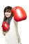 Young woman wearing boxing gloves smiling