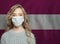 Young woman wearing a face mask with Latvia  flag. Flu epidemic and virus protection concept