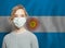 Young woman wearing a face mask with national flag Argentina. Flu epidemic and virus protection concept