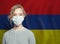 Young woman wearing a face mask with national flag Armenia. Flu epidemic and virus protection concept