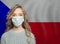 Young woman wearing a face mask with national flag Czech Republic. Flu epidemic and virus protection concept