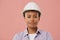 Young Woman Wearing Hardhat Posing on Pink