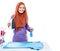 Young woman wearing hijab jolding iron and perfume spray