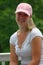 Young woman wearing a pink baseball hat