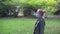 Young woman wearing protective mask walks in the park. New Rules and social distance