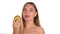 Young woman wears red lipstick and has her hair down, and brushed, eating a big, juicy pear. healthy food - strong