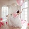 Young woman in wedding dress in luxury interior flies on pink and white balloons.