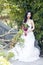 A young woman wedding photo/portrait sit on an ancient old bridge in Shanghai shui bo parkpark of water