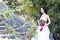 A young woman wedding photo/portrait sit on an ancient old bridge in Shanghai shui bo parkpark of water