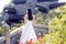 A young woman wedding photo/portrait stand on a ancient old bridge