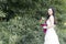 A young woman wedding photo/portrait stand by bamboo in Shanghai shui bo parkpark of water