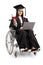 Young woman in a wheelchair wearing a graduation gown and holding a diploma and laptop