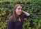 young woman whit dark t-shirt posing in garden