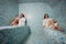 Young woman in white foam in a beautiful hamam of mosaic.