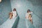 Young woman in white foam in a beautiful hamam of mosaic.