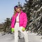 Young woman winter portrait. Winter fashion model with ski suit and goggles. Attractive young woman in wintertime outdoor.