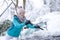 Young woman in winter wonderland in the snow