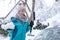 Young woman in winter wonderland in the snow