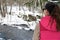 Young woman in wintry forest