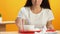 Young woman wiping mouth with paper napkin after fast food lunch, good manners