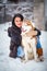 Young woman with wolf dog in snow husky