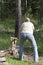 Young woman wood-chopping