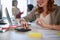 Young woman at work, calculating with smile in the office. casual business concept