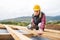 Young woman worker on the construction site.