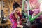 Young woman working in a bicycle repair shop