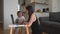 Young woman working from home with little child. Happy mother`s home office