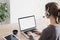 Young woman working at home, Student girl using laptop computer with headset.