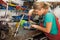 Young woman working in a mechanic shop