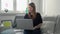 Young woman working remotely at home with computer laptop. Covid-19 coronavirus