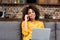 young woman working and talking by phone at home