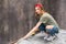 Young woman working with tape and preparing room for renovation home